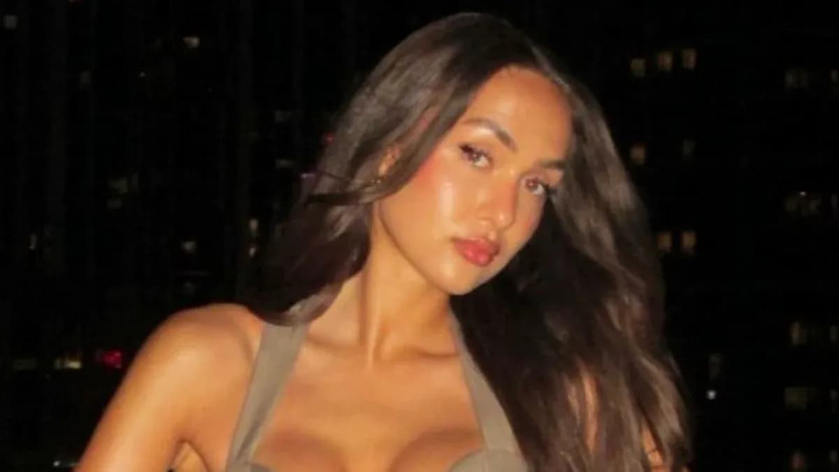 Person posing with long hair at night