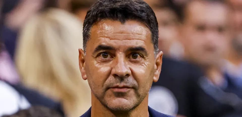 Coach observing the match from the sidelines