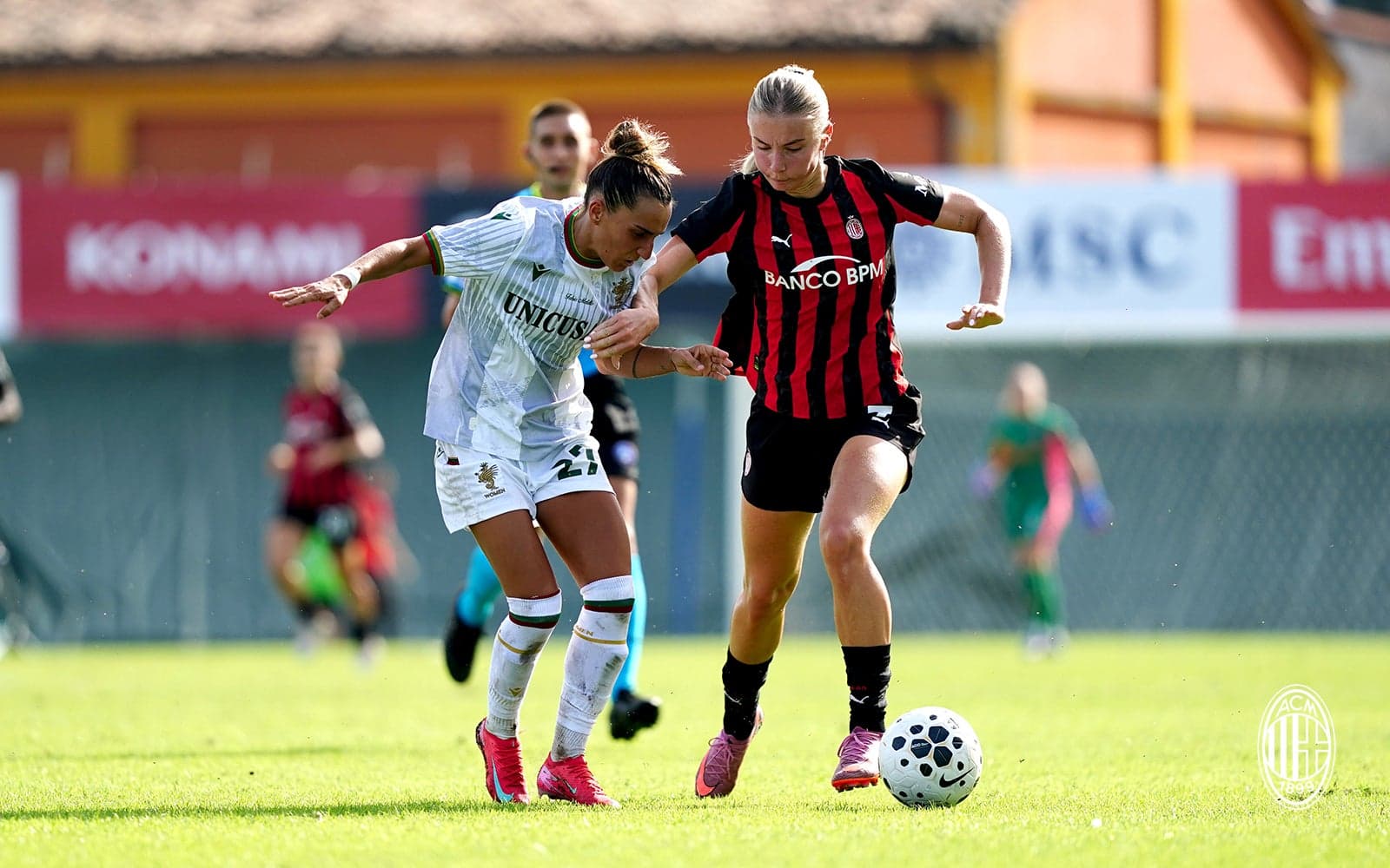 Two players competing for the ball in match