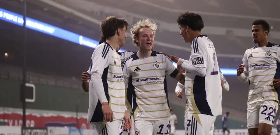 Players celebrating a goal during North Texas match