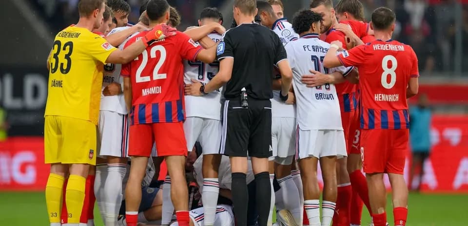 Players and referee gathered during match confrontation