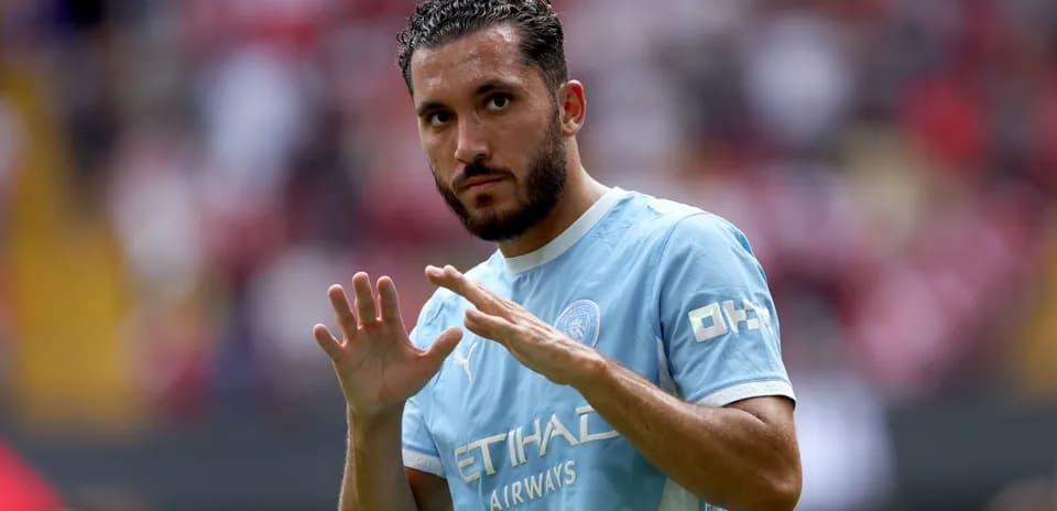 Player gesturing during warm-up on the field