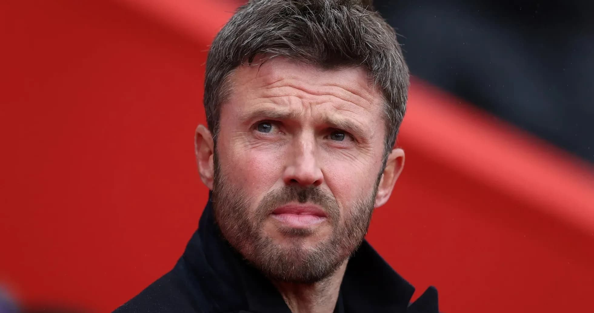 Coach observing from the sidelines during a match