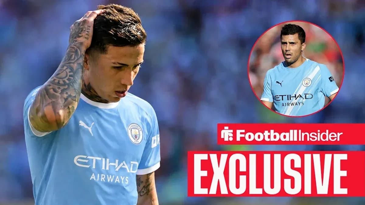 Player looking down while wearing Manchester City jersey