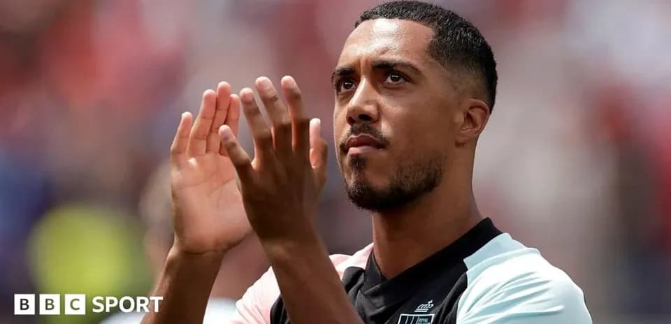 Player applauding fans during match