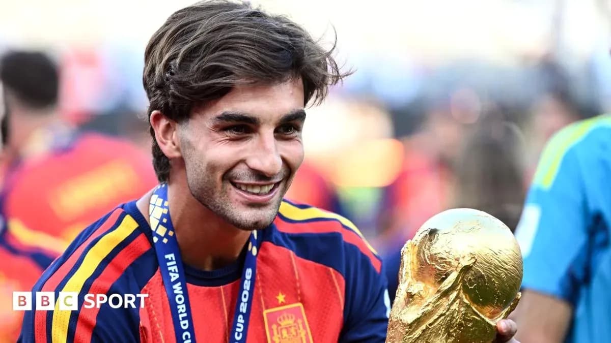 Player celebrating with FIFA World Cup trophy