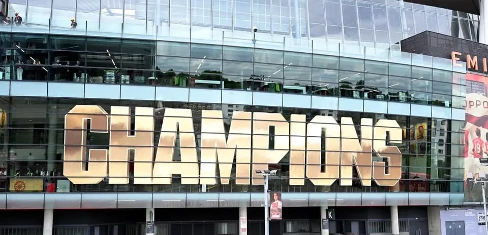 Emirates Stadium displaying 'CHAMPIONS' sign
