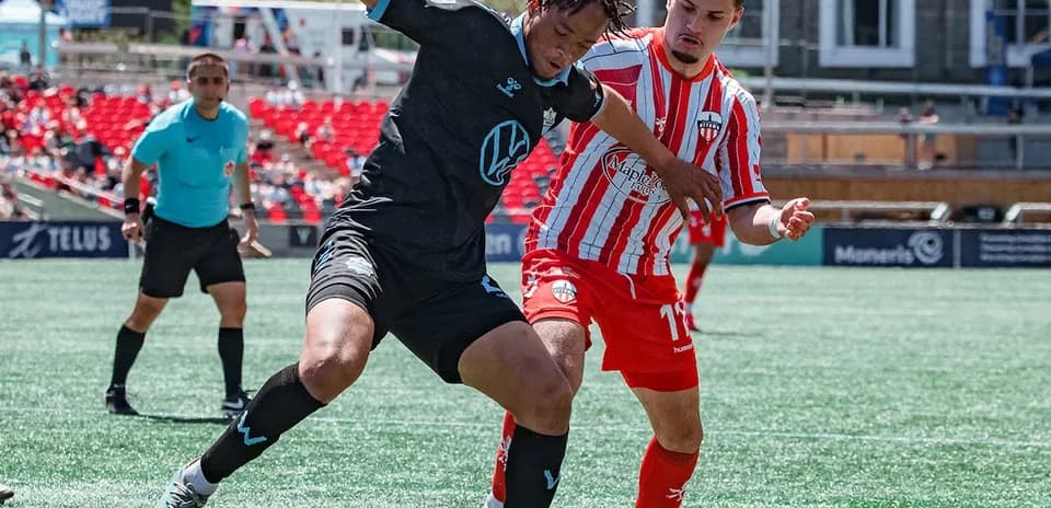 Player tackling during HFX Wanderers FC match