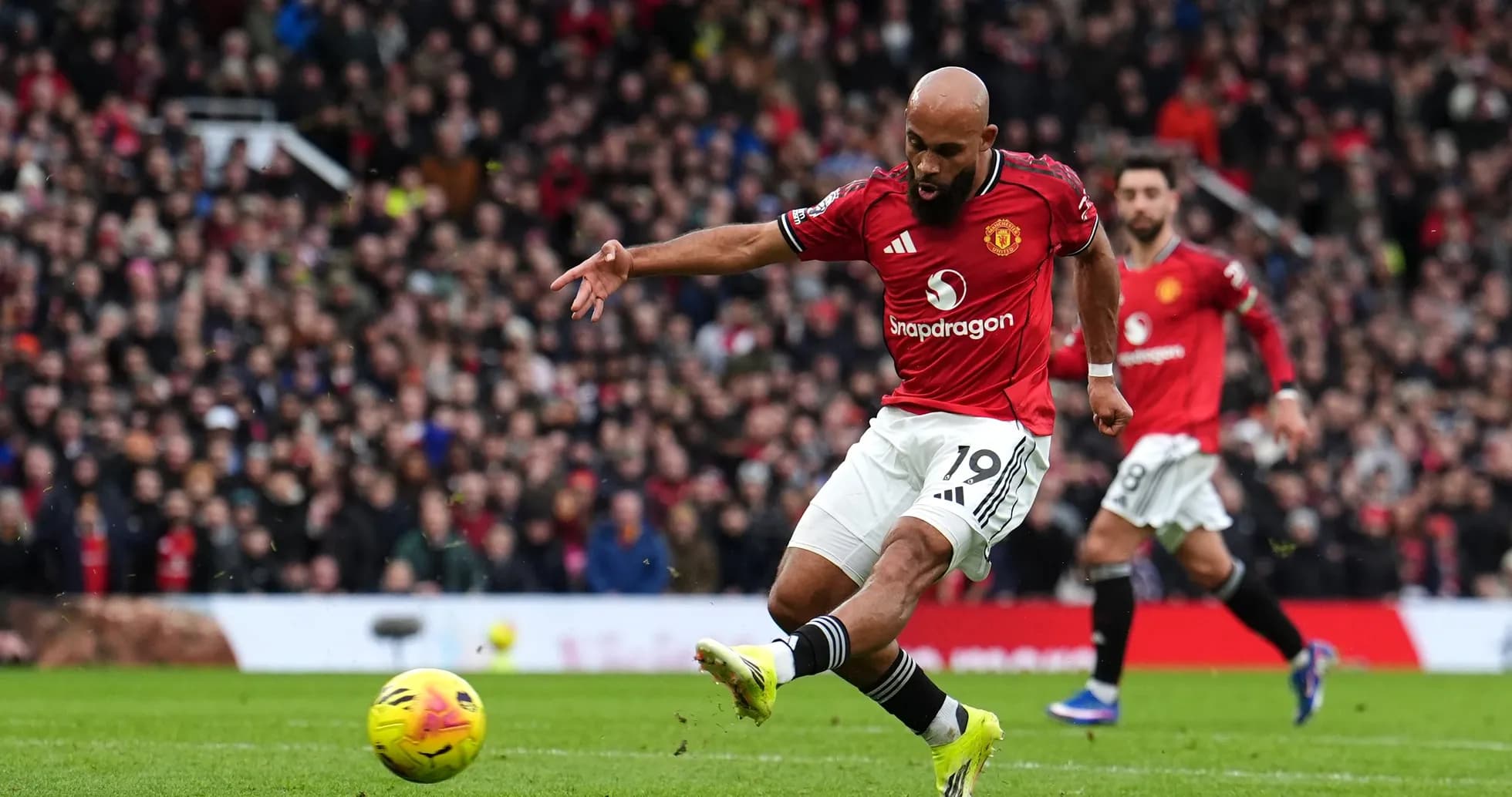 Manchester United player shooting at goal