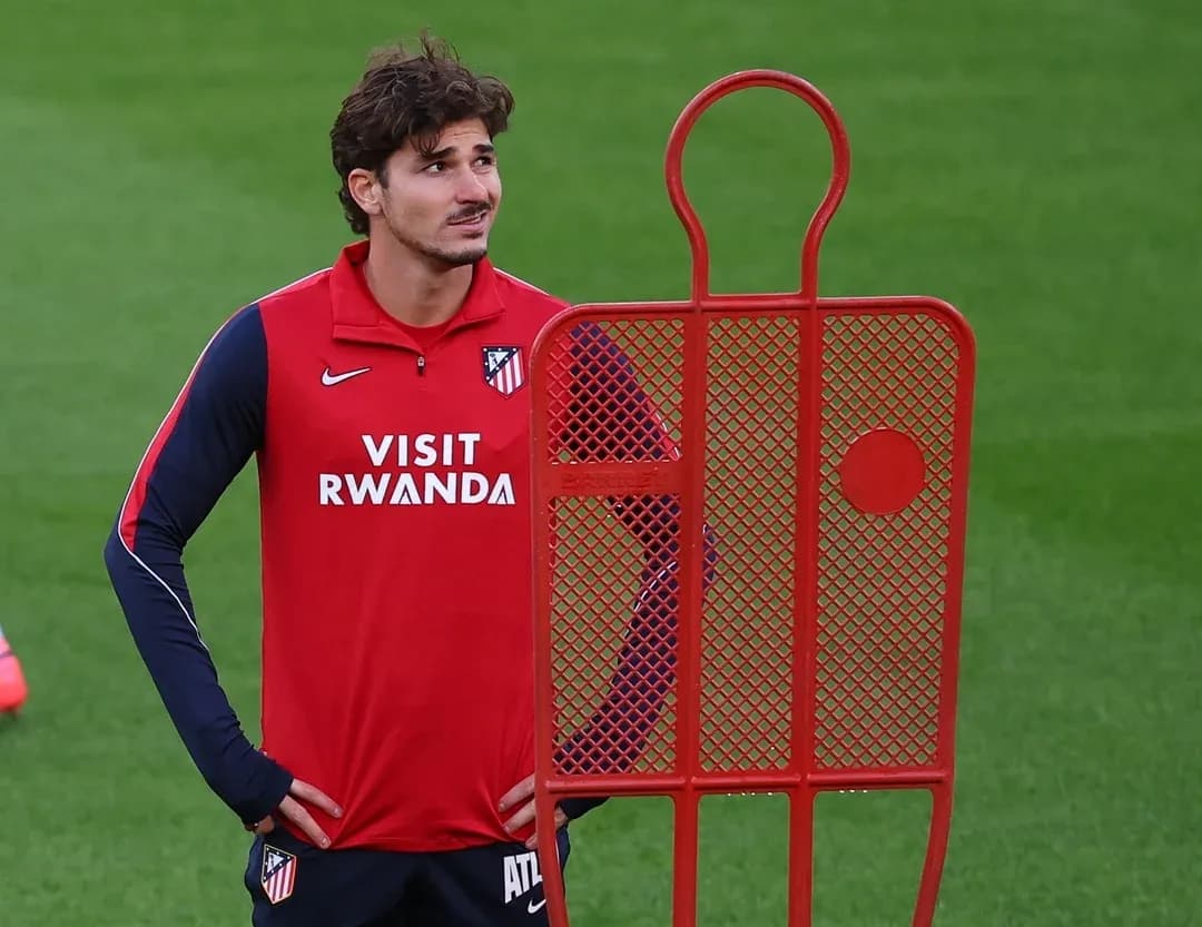 Player standing next to training dummy on pitch