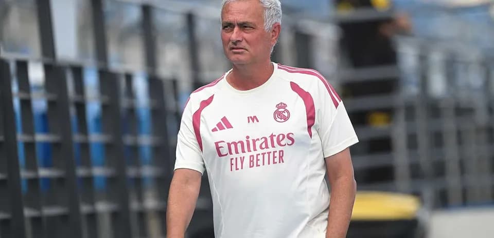 Coach walking on the training pitch at Madrid