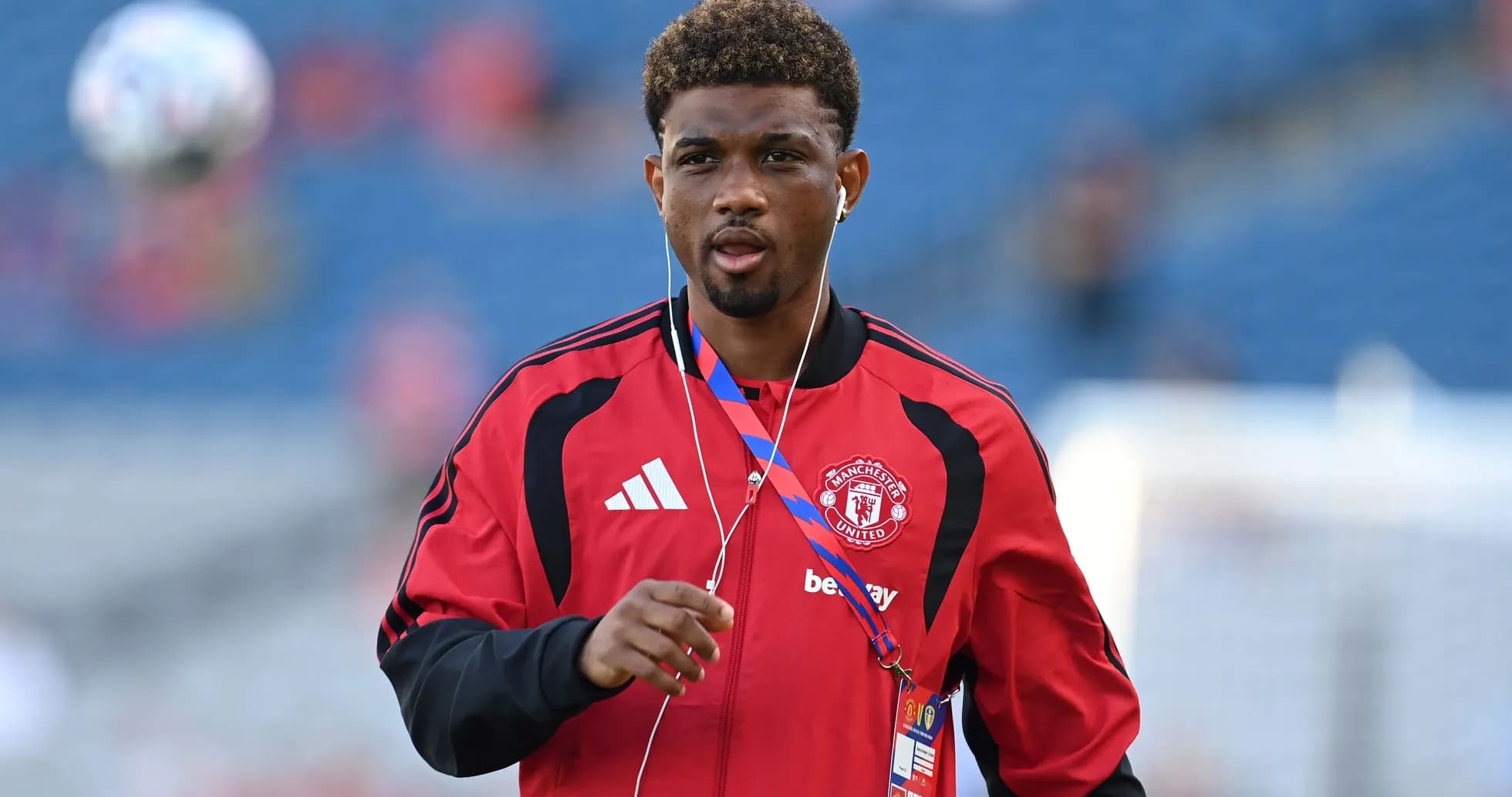 Player warming up in Manchester United training kit