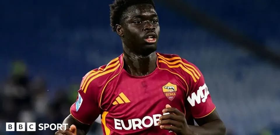 Player in AS Roma kit running on the pitch