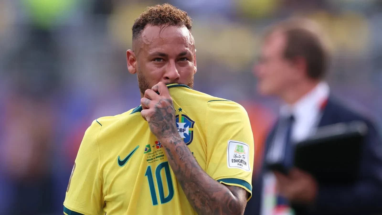 Neymar holding his jersey during match
