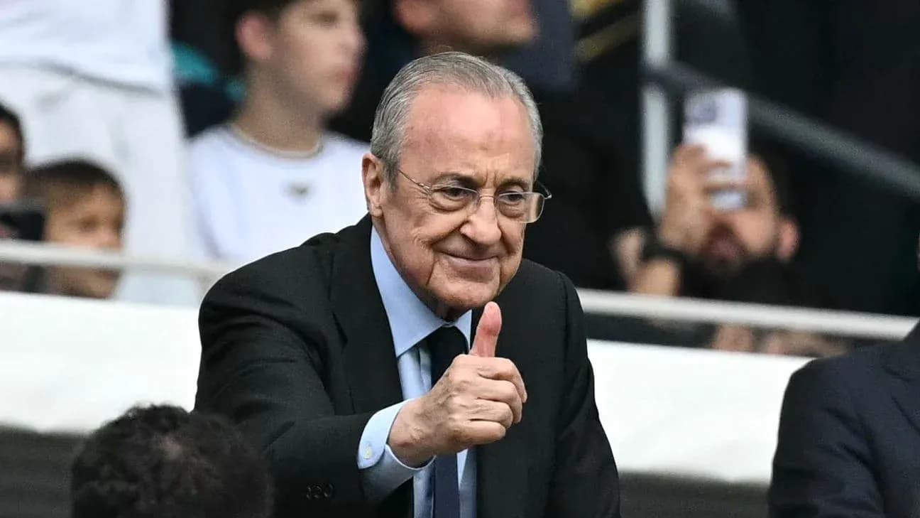 Man giving thumbs up in stadium stands