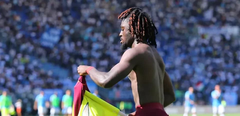 Player removing jersey during match celebration
