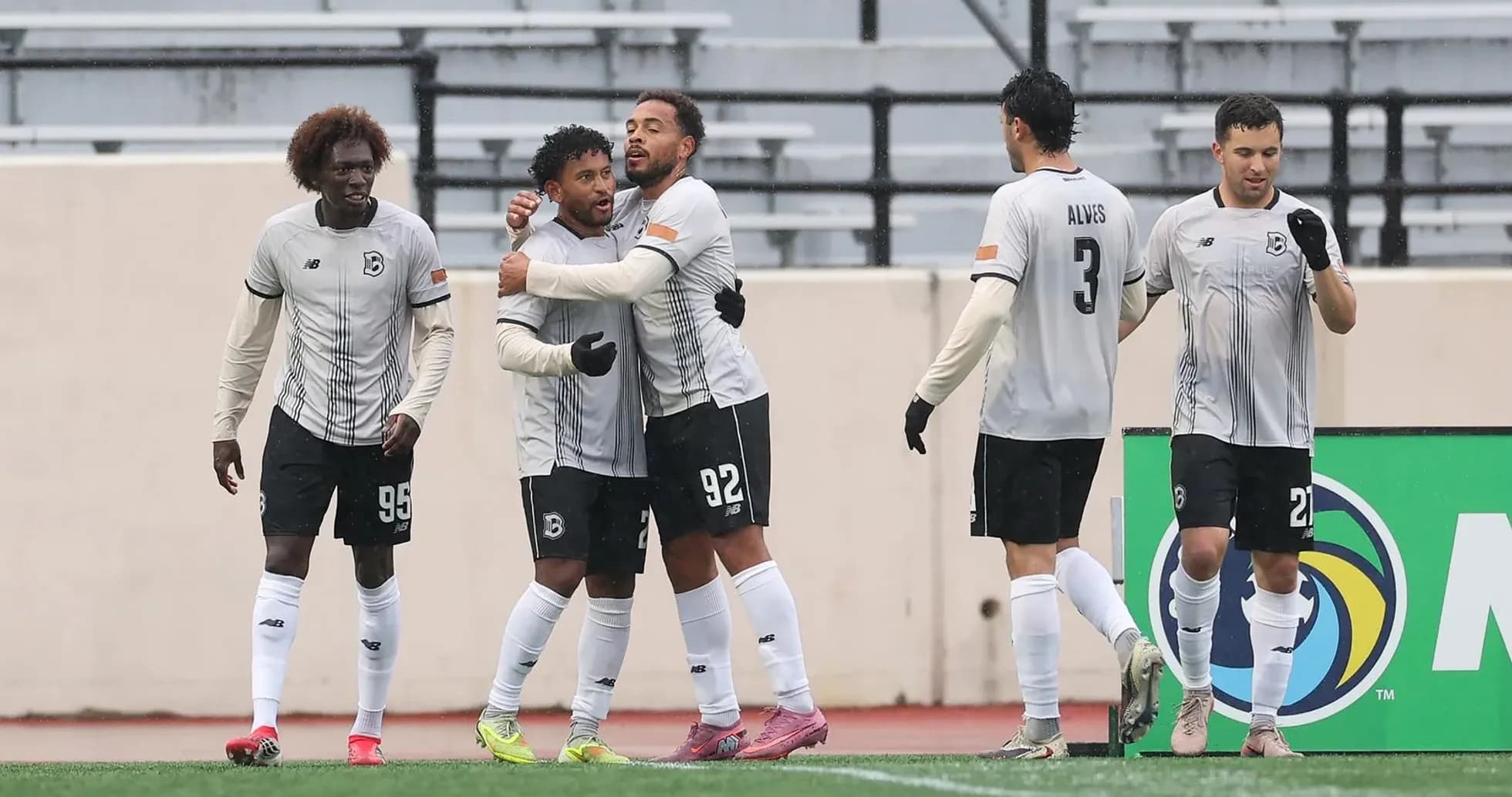 Players celebrating a goal during USL Championship match