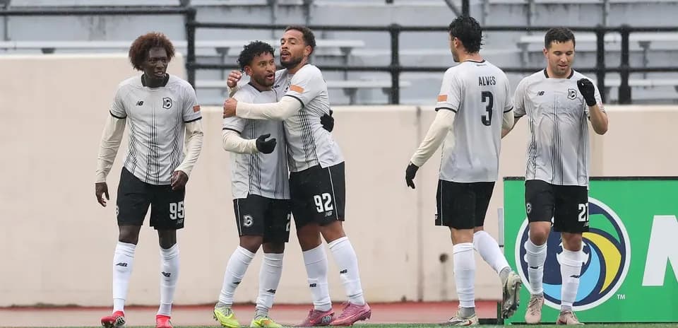 Players celebrating a goal during USL Championship match