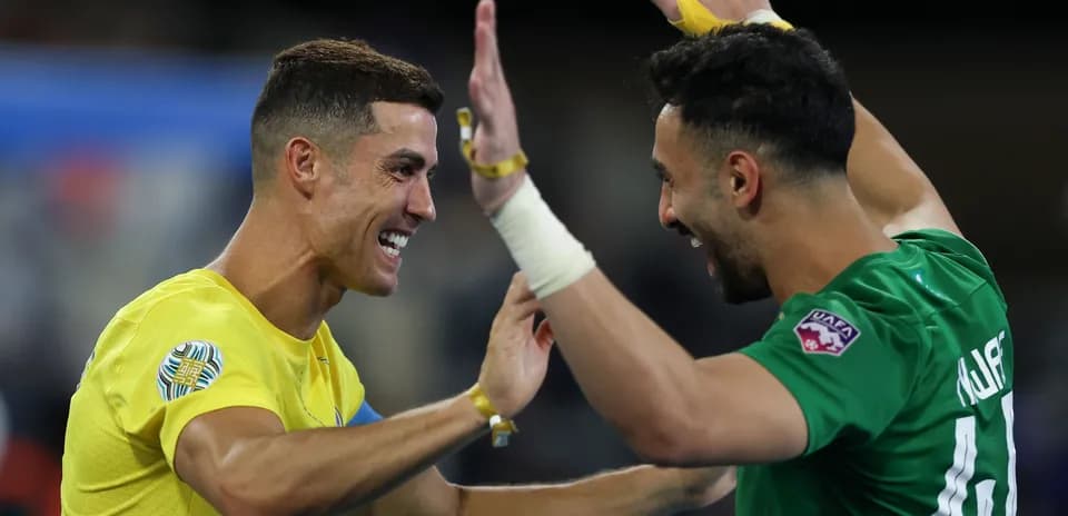 Two players celebrating a victory on the field