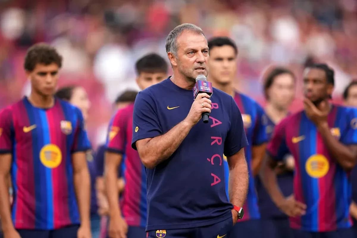 Coach speaking at Barcelona team event with players