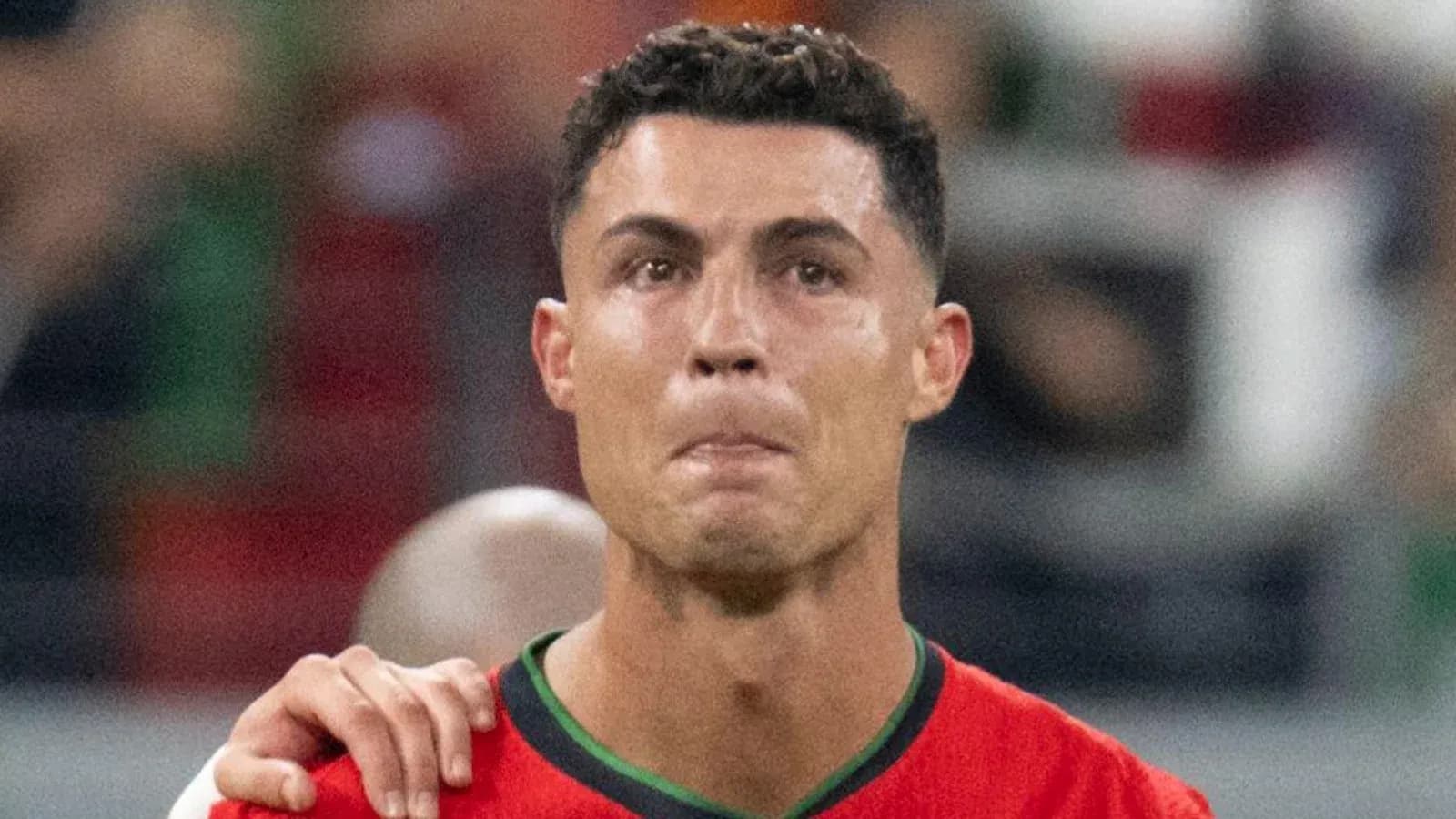 Player in red jersey with emotional expression