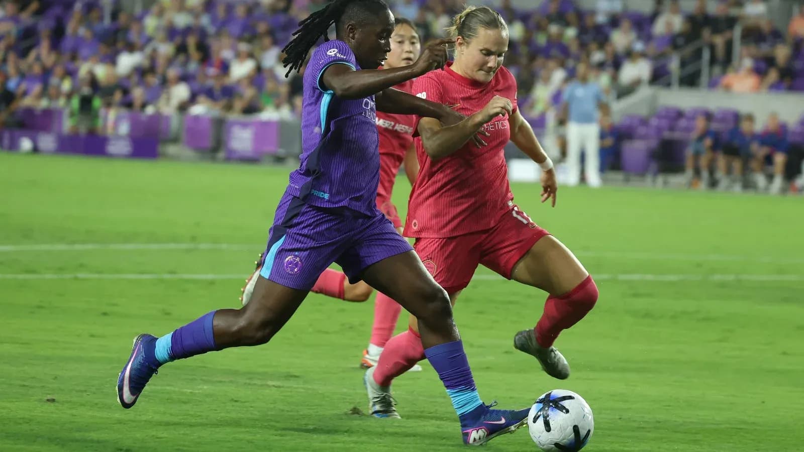 Boston Legacy W player dribbling against Orlando Pride W