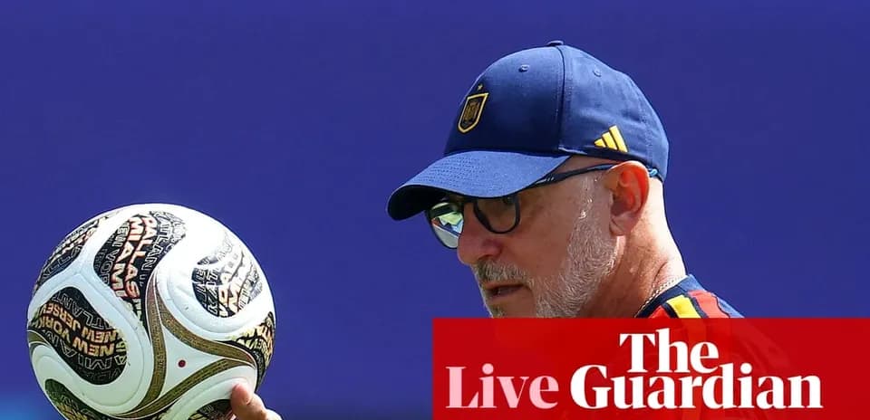 Coach holding a soccer ball during practice