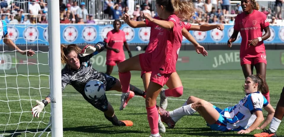 Goalkeeper saving a shot during match action