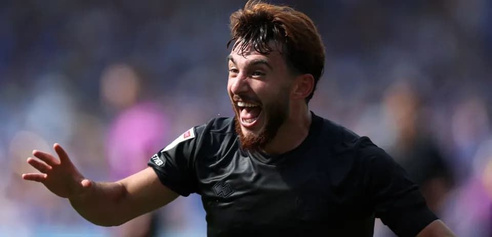 Player celebrating after scoring a goal during match