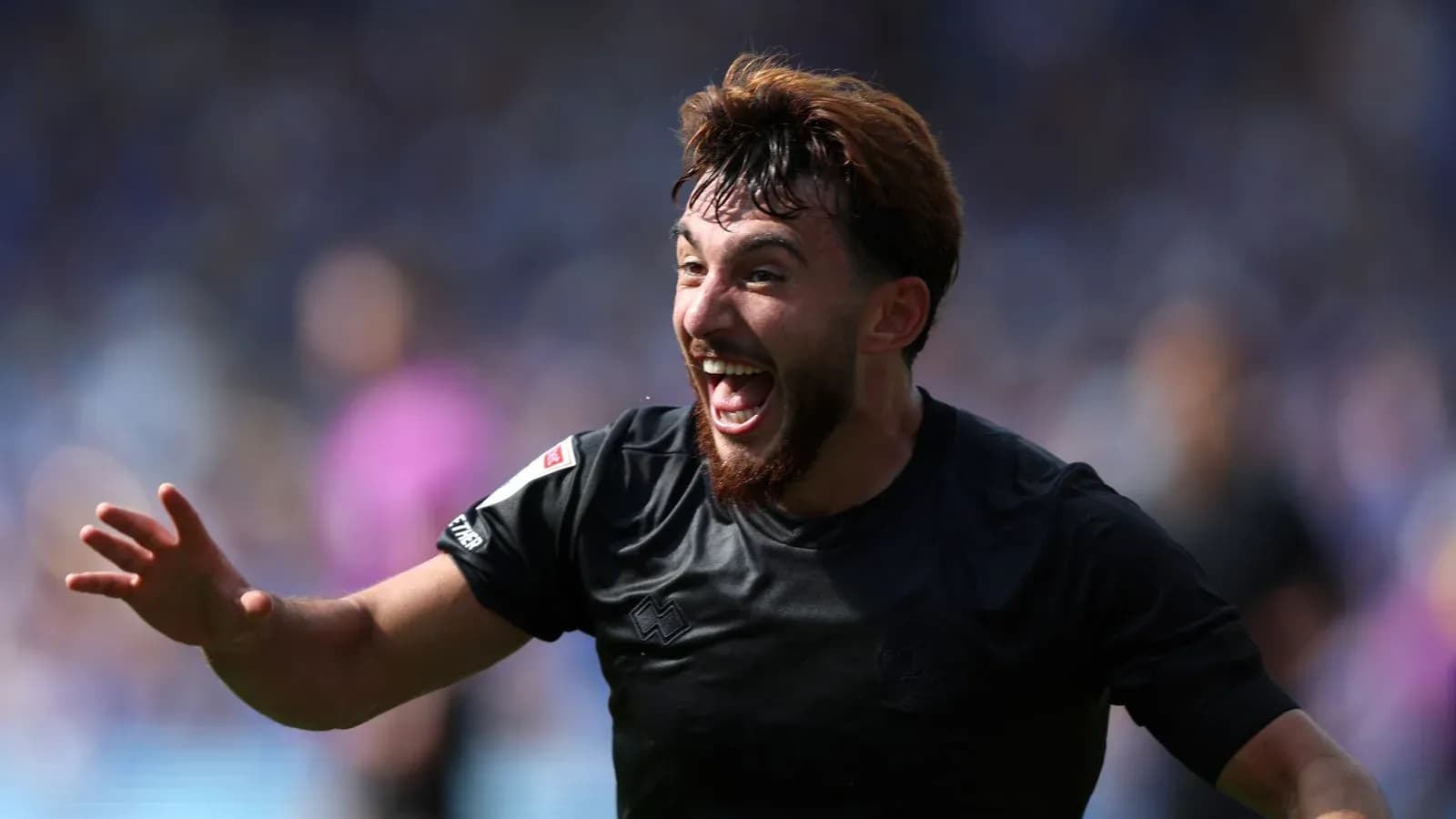 Player celebrating after scoring a goal during match