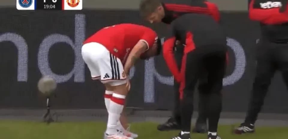 Player receiving medical attention on the sidelines