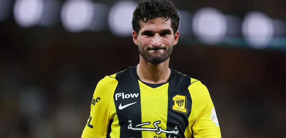 Player in yellow and black jersey on the field