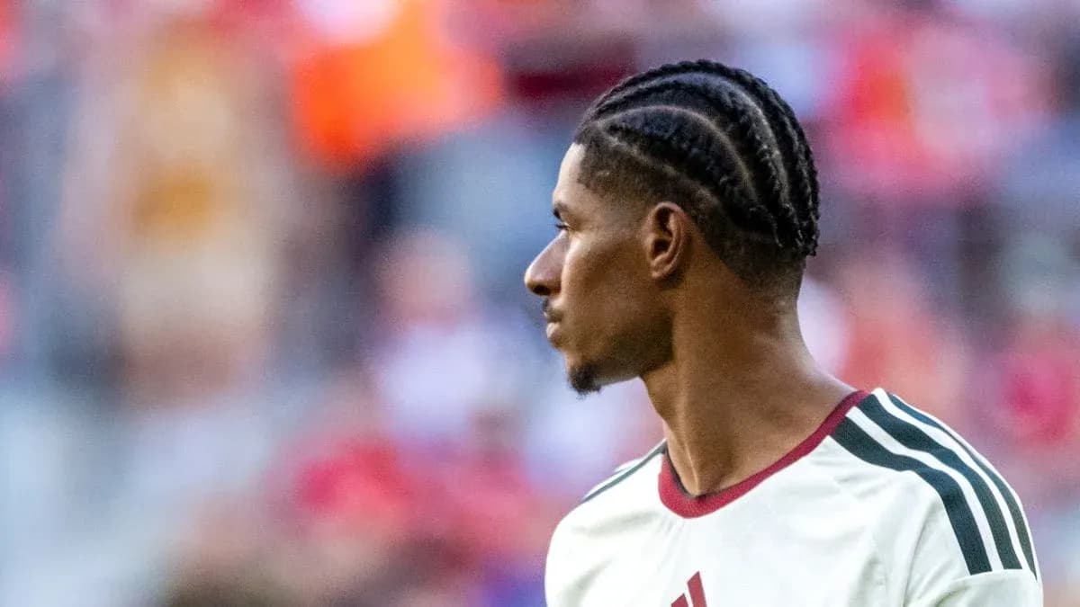 Player with braided hair during match warm-up
