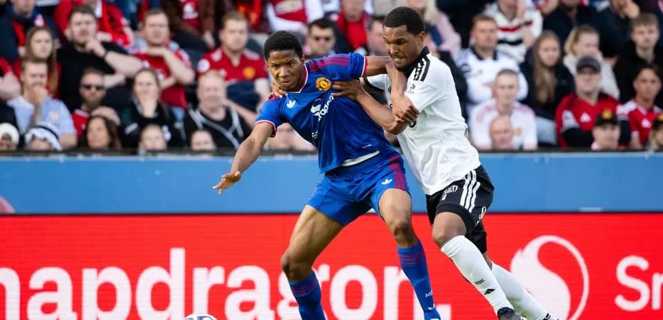 Two players battling for the ball during match
