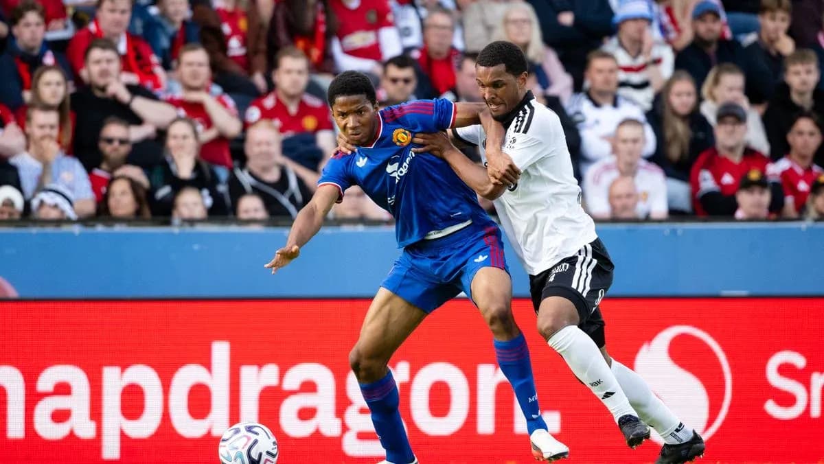 Two players battling for the ball during match