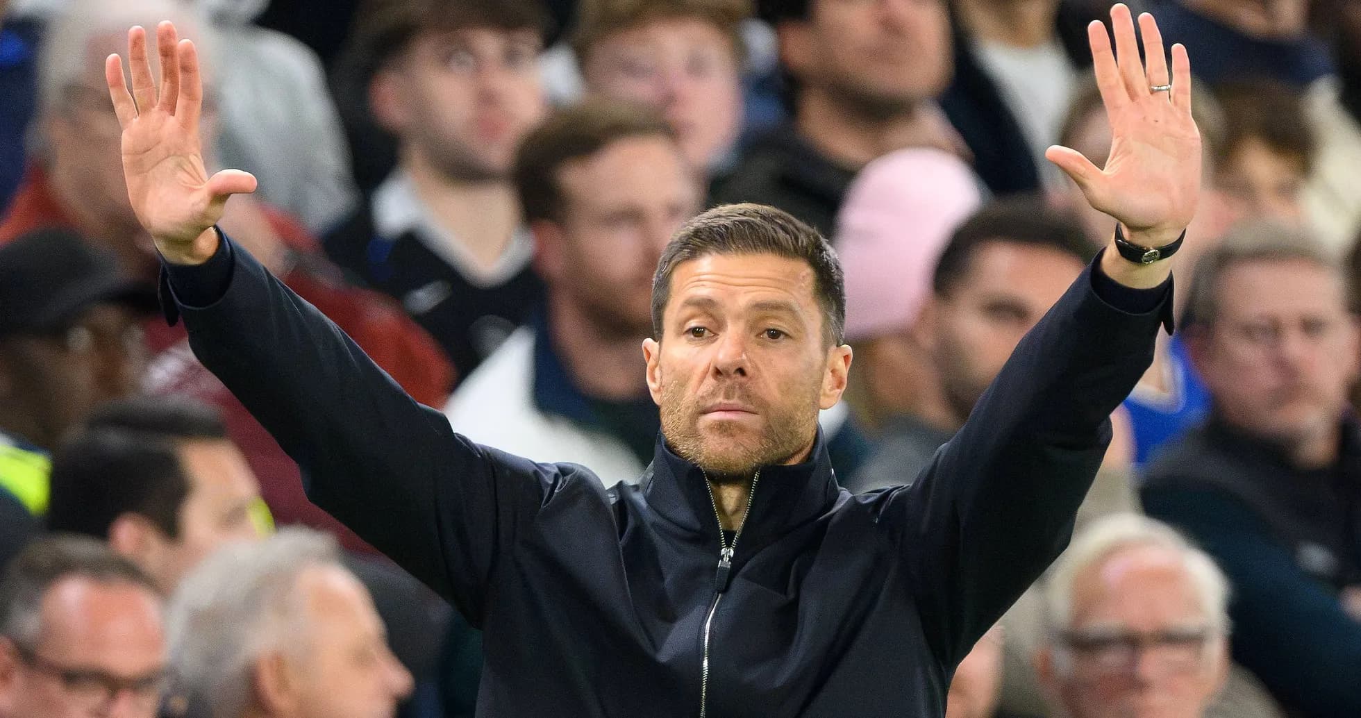 Coach gesturing towards players during match