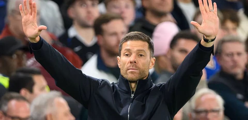 Coach gesturing towards players during match