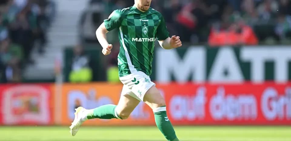 Player running with ball during a football match