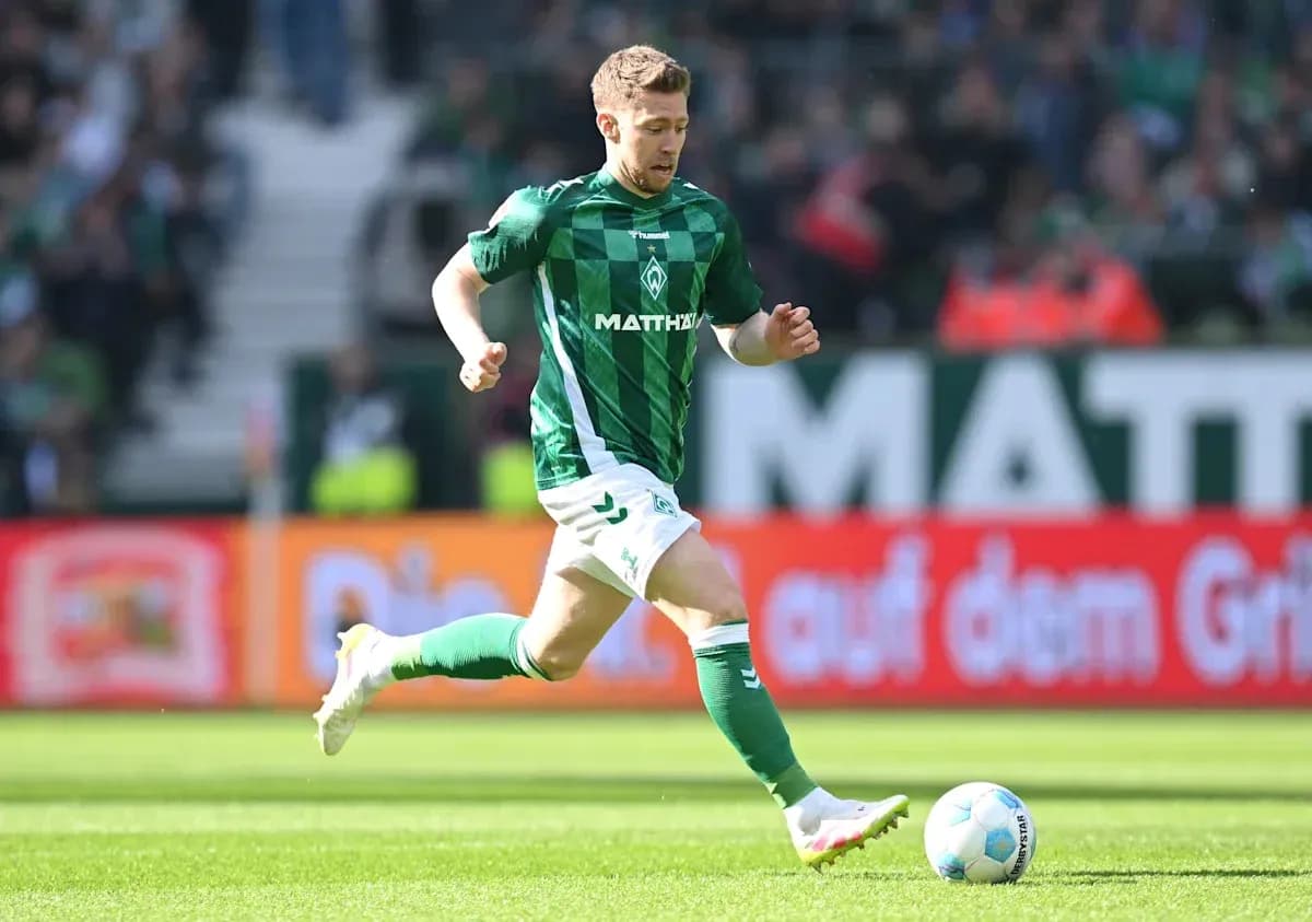 Player running with ball during a football match