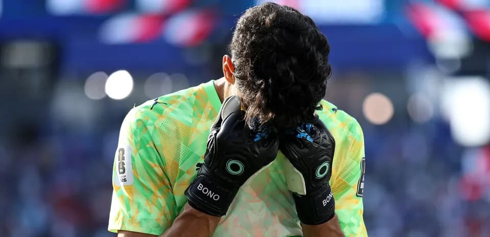 Goalkeeper with head in hands during match
