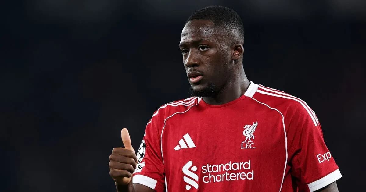 Player in Liverpool jersey giving thumbs up gesture