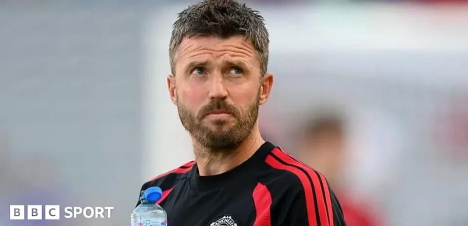 Coach holding a water bottle during training session
