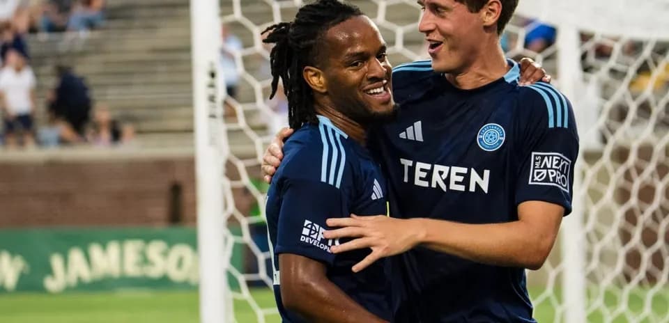 Players celebrating after scoring a goal