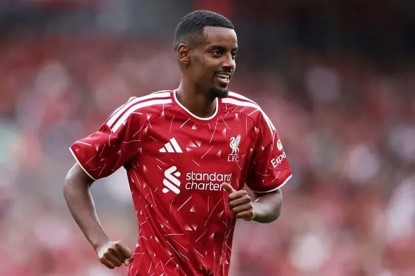Player celebrating in Liverpool FC home kit