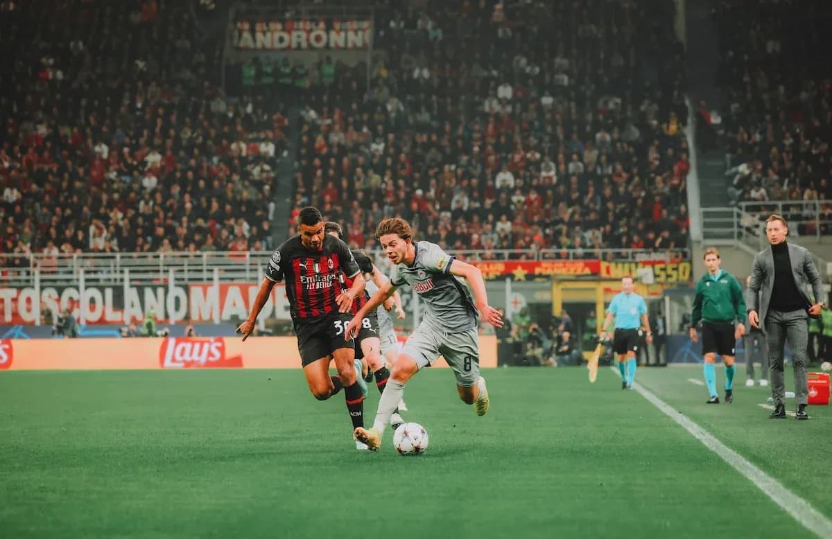 Player tackling during Red Bull Salzburg vs AC Milan match