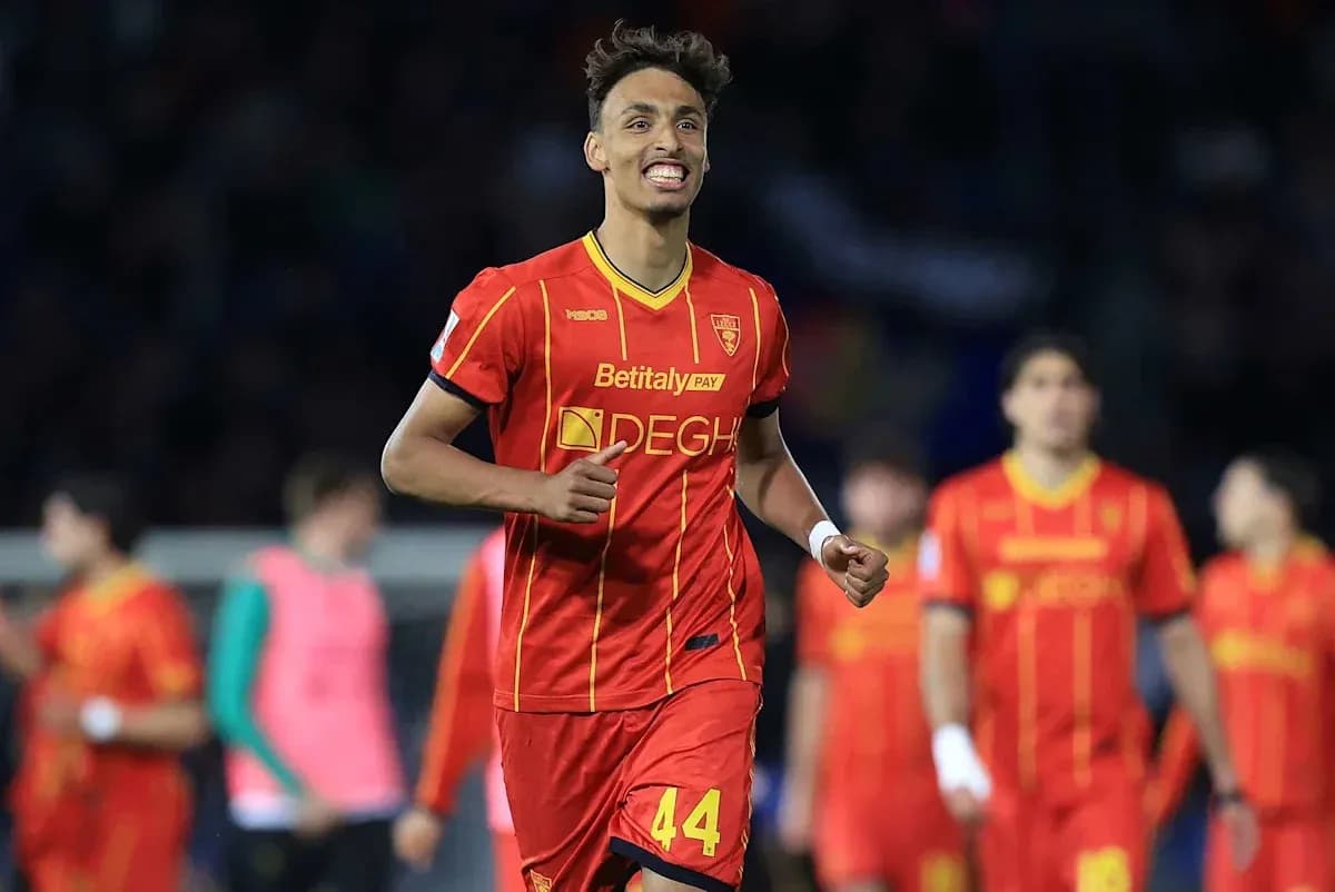 Player celebrating in red jersey after scoring goal