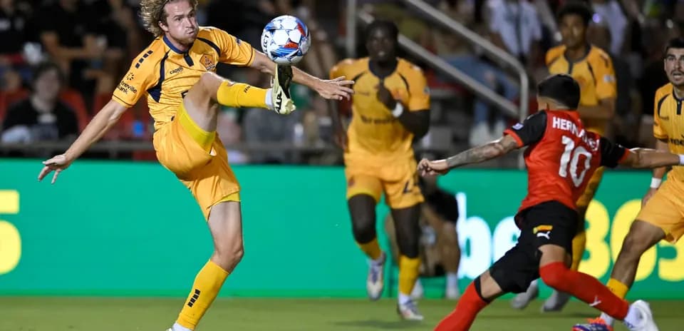 Player attempting to control the ball in match