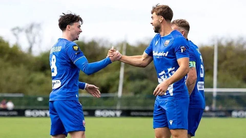 Players celebrating a goal during training session