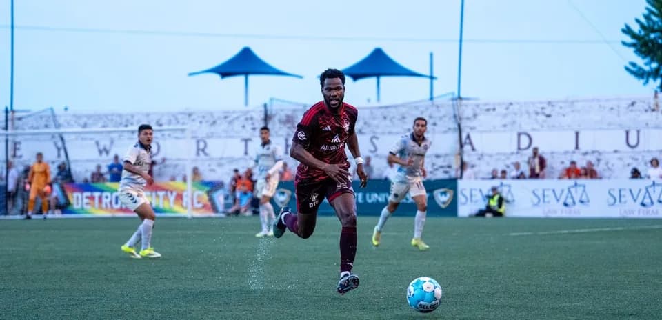 Detroit City player pursuing the ball during match