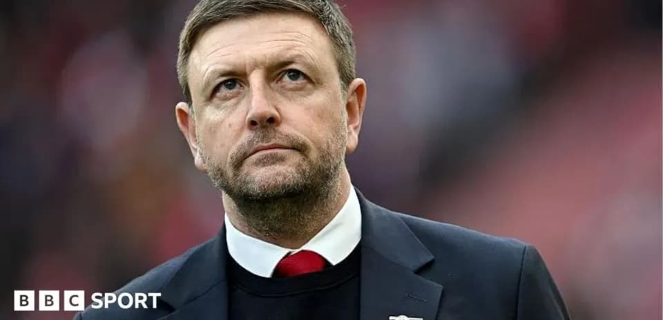 Manager looking on during match at stadium